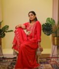 This vibrant ensemble is an amalgamation of varied hand embroidered crafts like resham and pearl work along with zardozi dabka work on the shirt (kurta). With its light, chinon dupatta the sharara and shirt set becomes perfect for special occasions, weddings, or festivals.